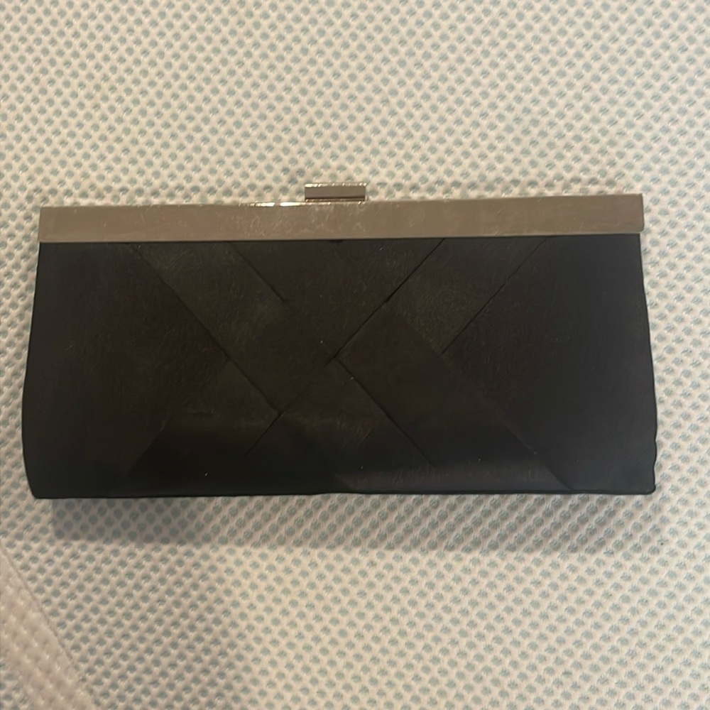 Lightly used black and silver clutch